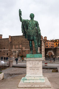 Statue of historic building against sky