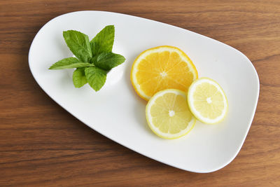 High angle view of fruits in plate on table