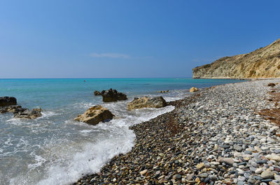 Scenic view of sea against clear blue sky