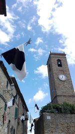 Low angle view of bell tower against sky