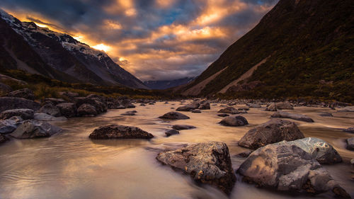 Scenic view of river against sky during sunset