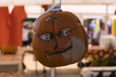 Close-up view of pumpkin against orange background