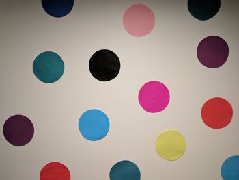 Low angle view of multi colored balloons