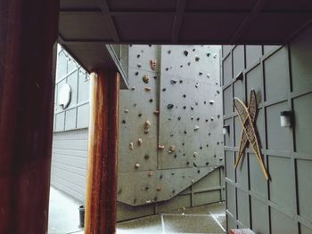 Low angle view of building seen through glass window