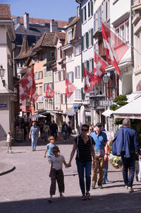 People walking on street in city