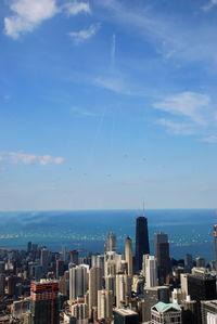 Modern buildings in city against sky