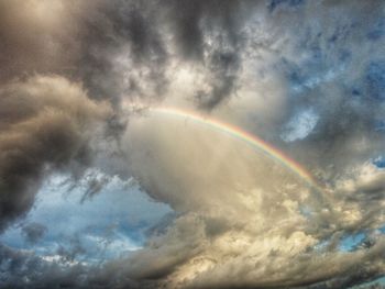 Low angle view of rainbow in sky