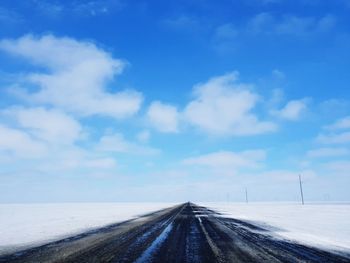 Road against sky during winter