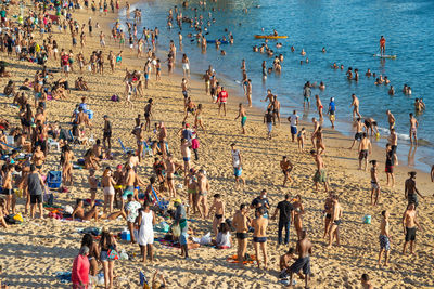 Many people flock to the beach at porto da barra, in salvador,