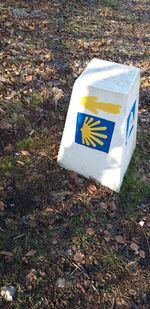 High angle view of information sign on field