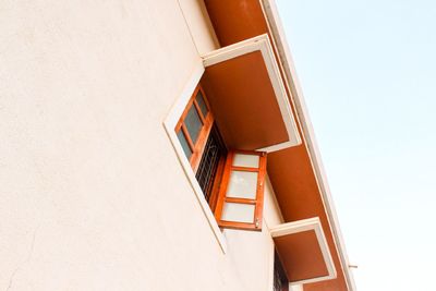 Low angle view of white building against clear sky