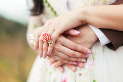 Groom hugs the bride with wedding ring, vintage lace dress. concept of marriage, love, and family