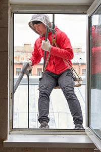 Man working on window