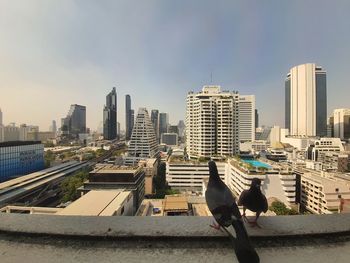 View of city buildings against sky