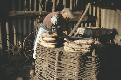 Man working on barbecue grill