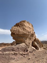 Rock formations in desert against sky