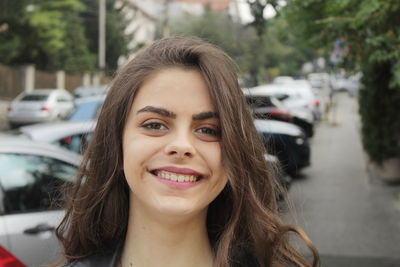 Portrait of smiling young woman in car