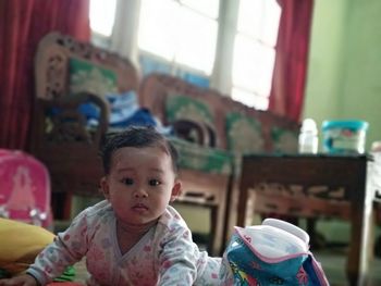 Portrait of girl sitting at home