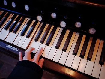 Cropped image of man playing piano