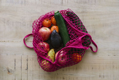 Eco friendly and reusable shopping mesh bag with fruits and vegetables