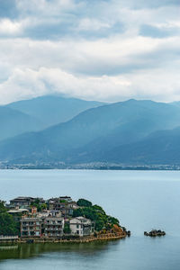 Townscape by sea against sky