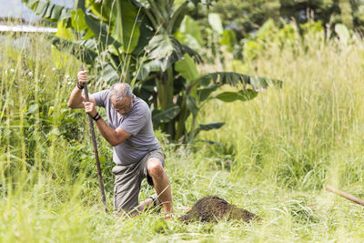 Full length of man standing on field