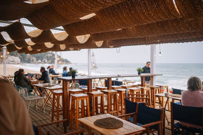 People in restaurant at beach