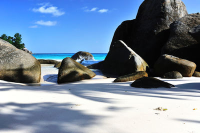 Panoramic view of sea by rock formation against sky