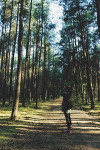 Full length of people walking in forest