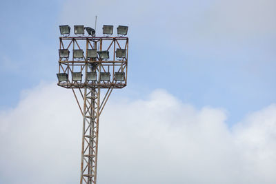 Low angle view of communications tower against sky