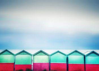 Beach huts against sky