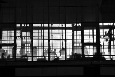 Silhouette people in airport building