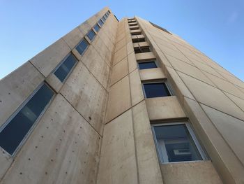 Low angle view of office building against sky