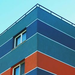 Low angle view of building against blue sky