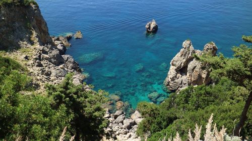 High angle view of rock formation by sea