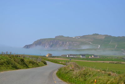 Country road passing through landscape