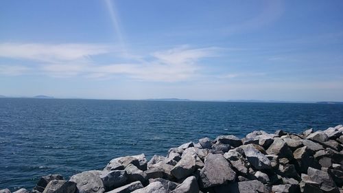 View of calm blue sea against sky