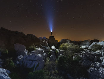 Panoramic view of rocks against sky at night