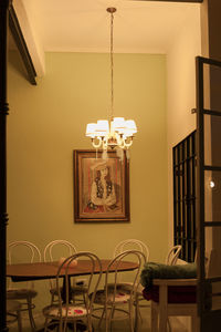 Illuminated electric lamp on table at home