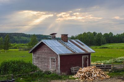 House on field against sky