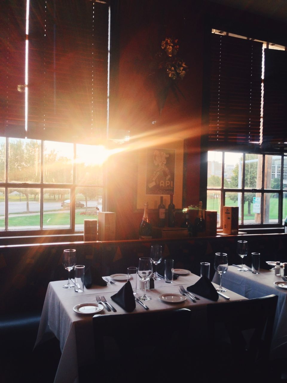 VIEW OF RESTAURANT TABLE IN ILLUMINATED ROOM