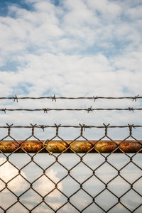 Chainlink fence against sky