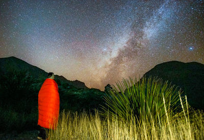 Scenic view of mountains against sky at night