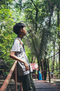 Side view of young man looking away