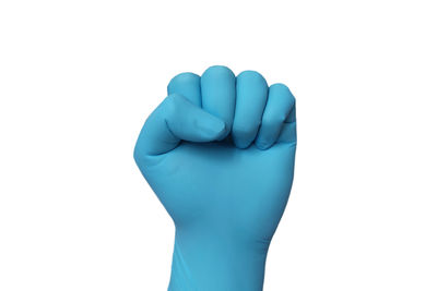 Close-up of human hand against white background