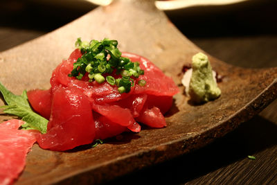 Close-up of fresh sashimi served in tray at restaurant