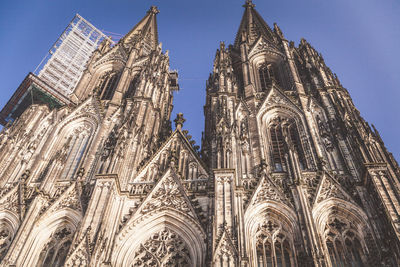 Low angle view of bell tower against sky