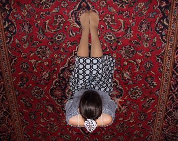 Low section of woman standing on tiled floor