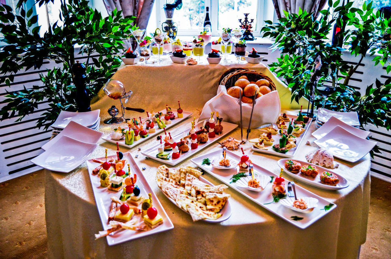 table, chair, food and drink, indoors, still life, freshness, plate, absence, food, variation, restaurant, day, high angle view, potted plant, no people, arrangement, sunlight, dining table, place setting, empty