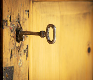 Close-up of key in door hole